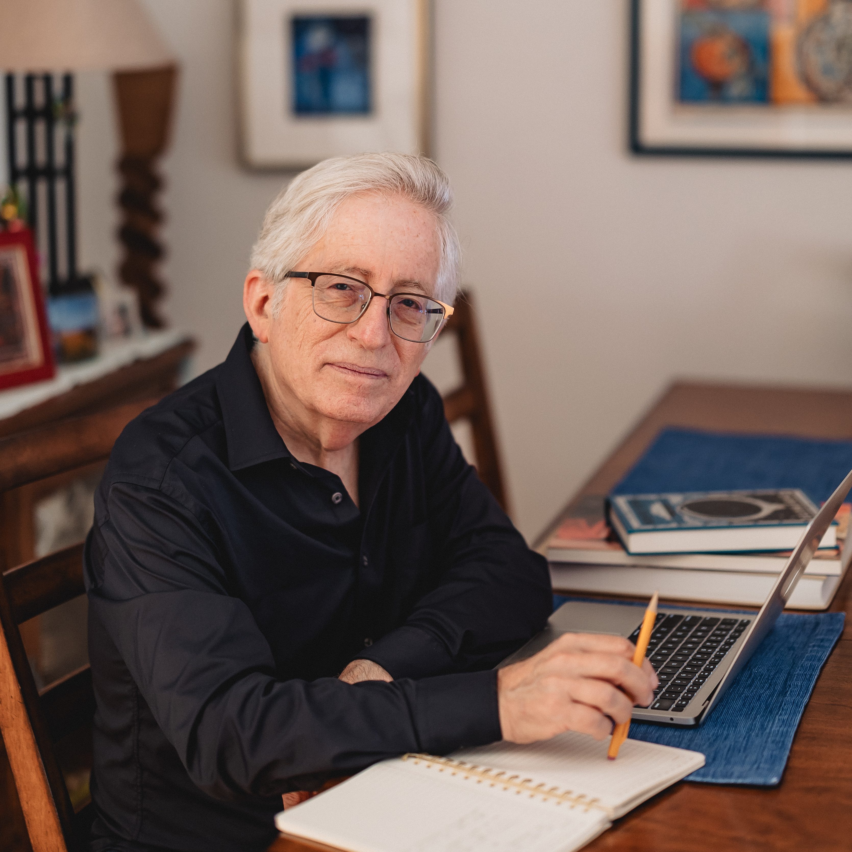 Bob Pincus at a table with his laptop